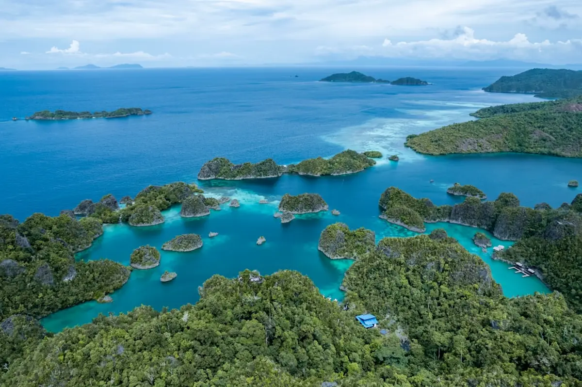 Aerial view of Raja Ampat karst islands and turquoise sea near Sorong